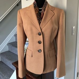 Two piece pants suit with scarf.